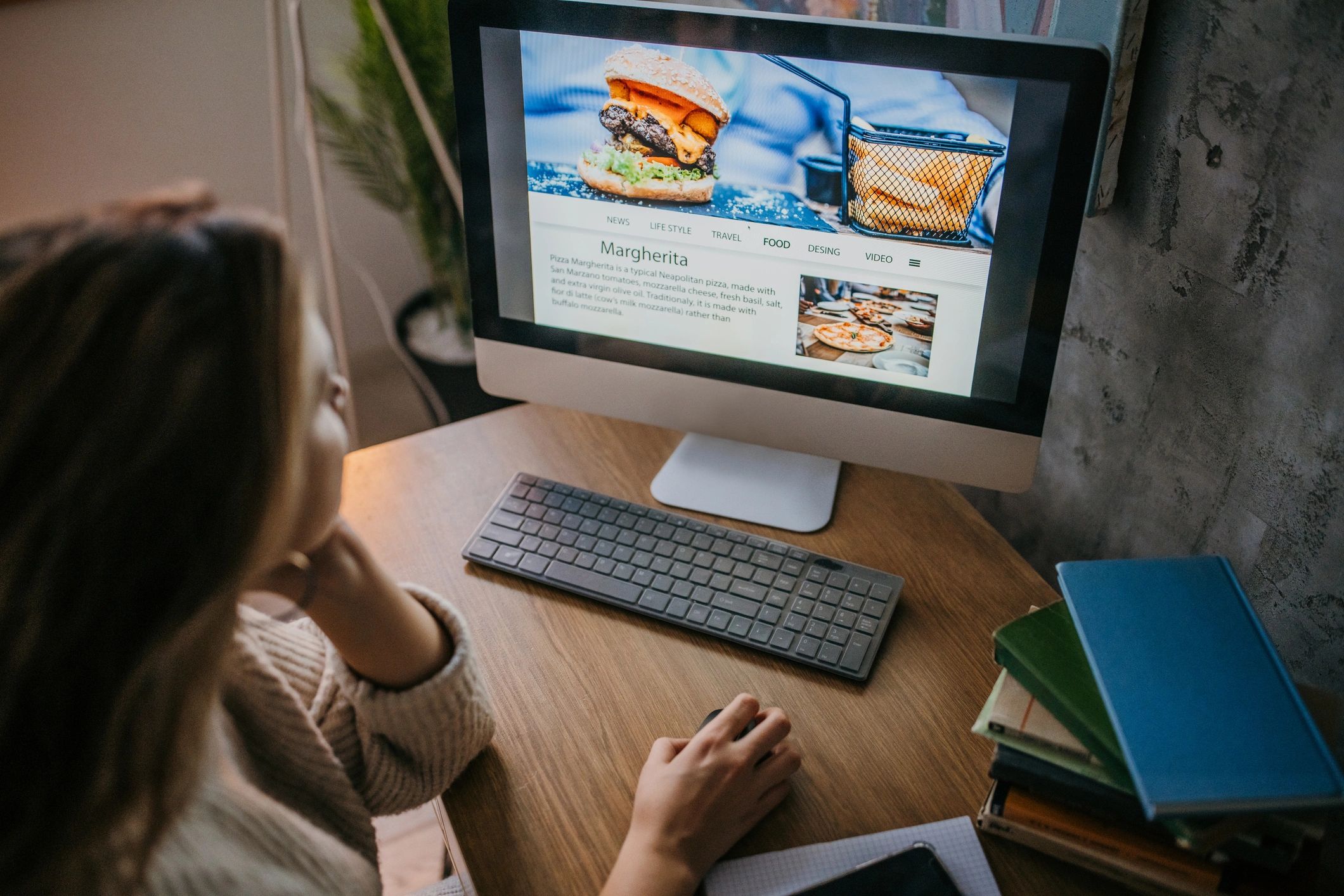 Person using a desktop computer at home