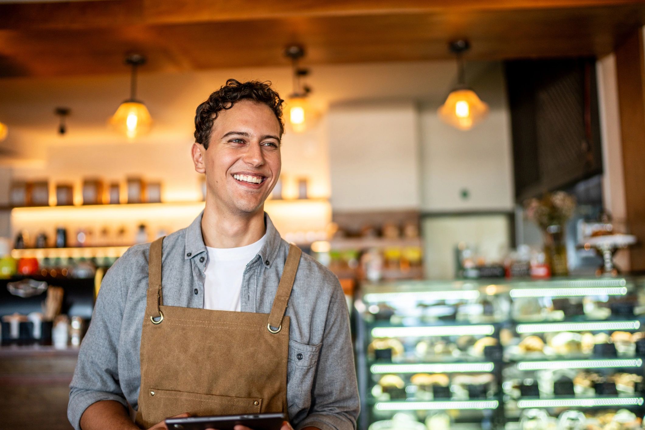 Small business owner outside a storefront representing local business growth