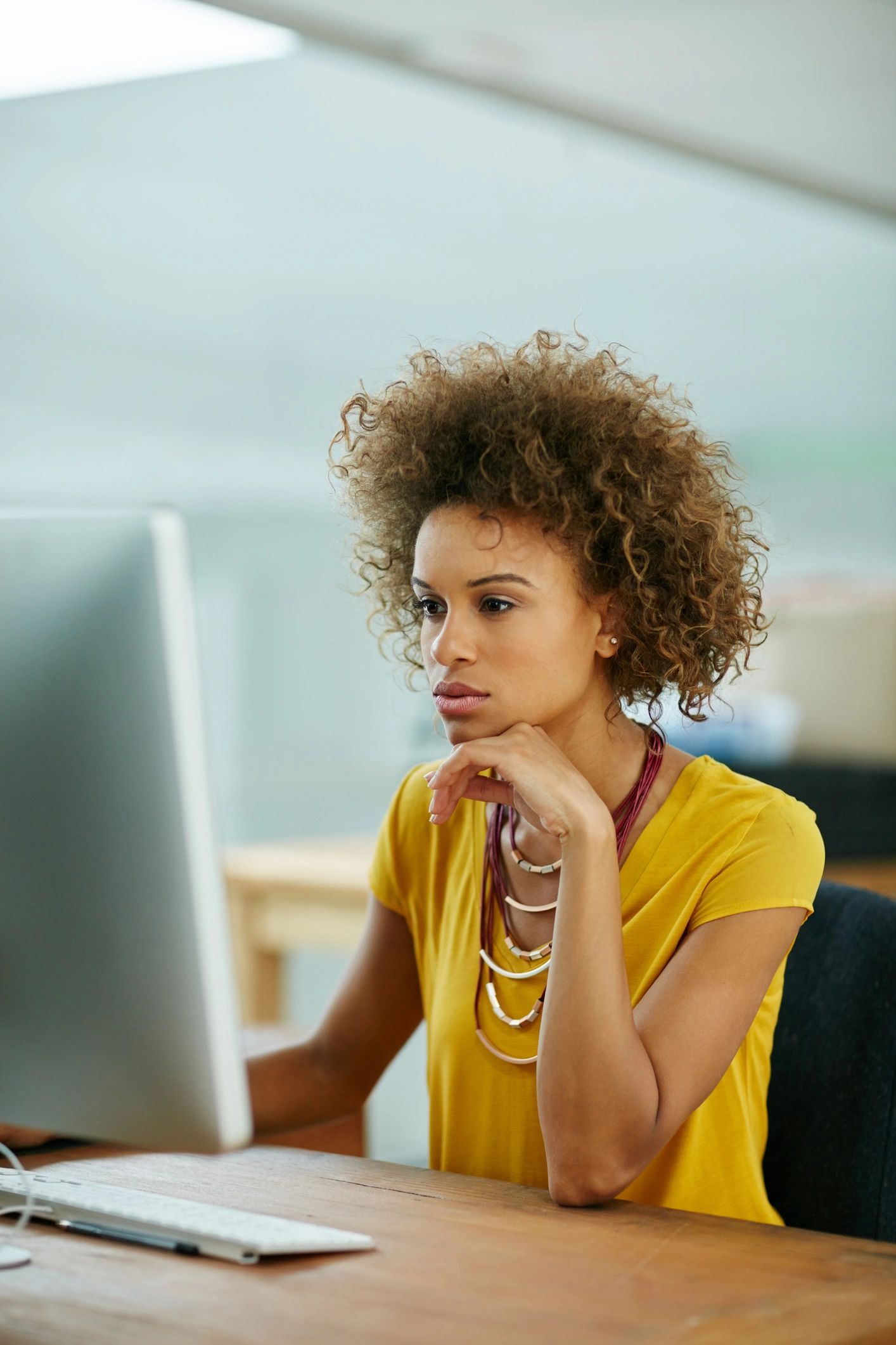 Small business owner working on a website redesign on a laptop